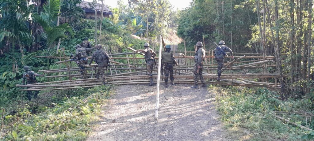Assam Rifles personnel clearing a road blockade at Gotaikhal, Jiribam District, Manipur.