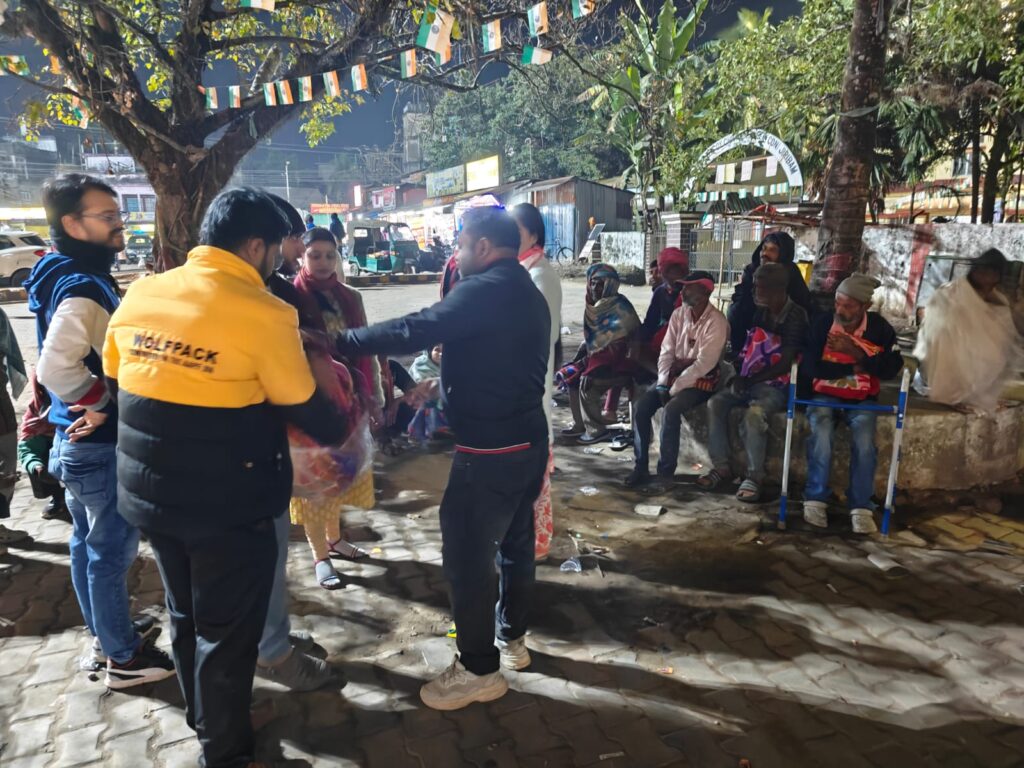 Thunderbolts team extending help to an elderly individual during their blanket distribution drive in Silchar.