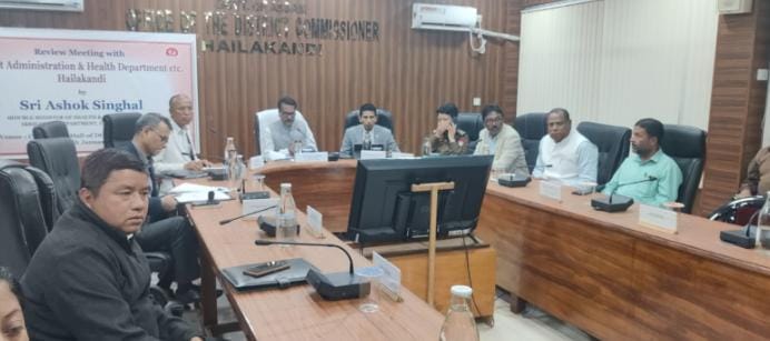 Assam Health Minister Ashok Singhal addressing officials during a health department review meeting in Hailakandi.