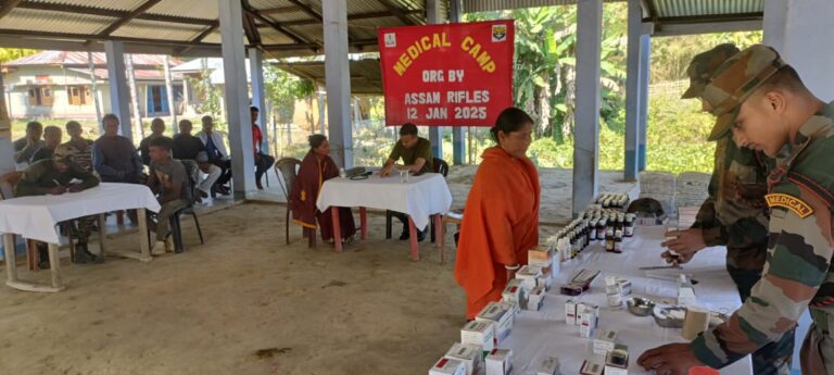 Assam Rifles personnel distributing free medicines to villagers during a medical camp in Gaukhal, Boro Bekera Sub Division, Manipur.