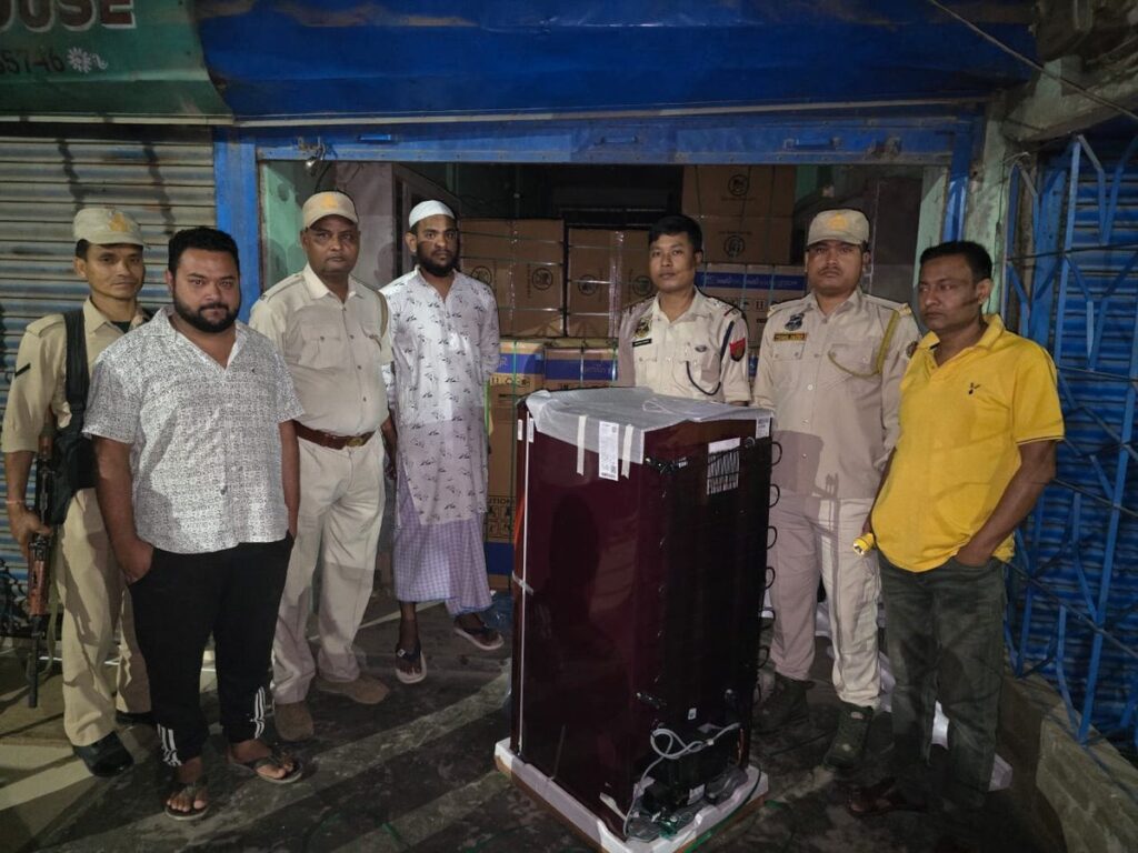 Four people were taken into custody by a Sribhumi (Karimganj) police team in Assam after they found an alleged stolen vehicle containing 54 refrigerators. Four people were taken into custody by a Sribhumi (Karimganj) police team in Assam after they found an alleged stolen vehicle containing 54 refrigerators.