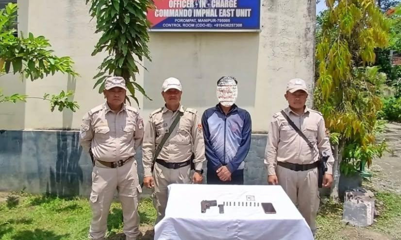 In Imphal West, Manipur police detain a suspected armed smuggler. In Imphal West, Manipur police detain a suspected armed smuggler.