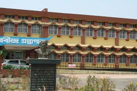 Front view of Swapna Devi Smriti Bhavan at Assam University, Silchar, with the commemorative bust of Swapna Devi.